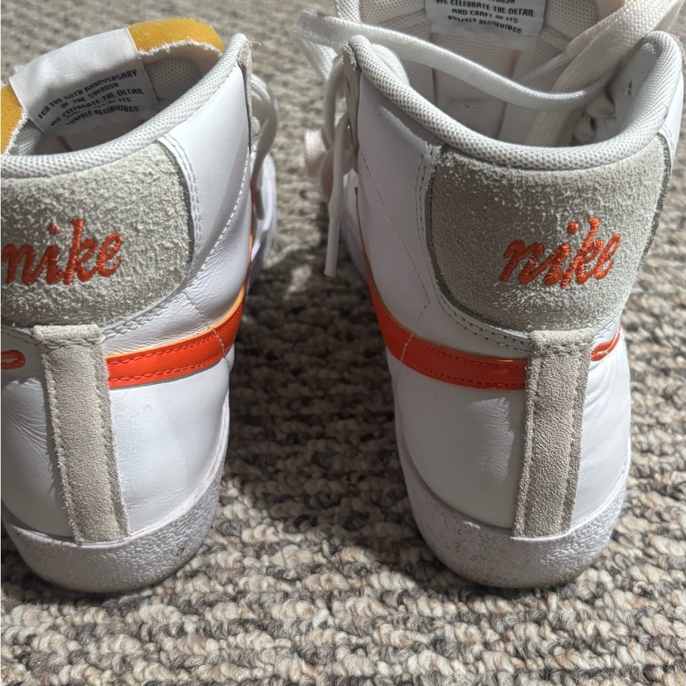 Nike Kids White and Orange High-Top Sneakers. Worn but still in good condition.